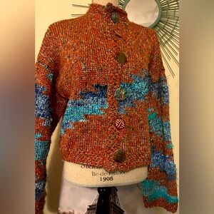 Hand made very heavy sweater with beautiful colors and artistic looking buttons.